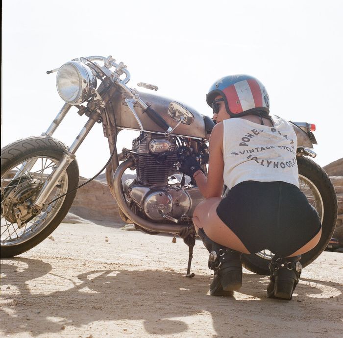 A playful frame from Girls on a motorcycle — online in Dallas
